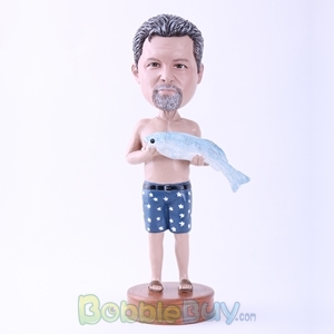 Picture of Man Holding A Fish Bobblehead