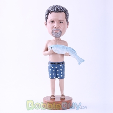 Picture of Man Holding A Fish Bobblehead
