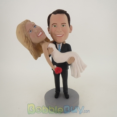 Picture of Groom Holds Wife Bobblehead
