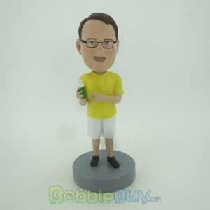 Picture of Casual Man In Yellow Having Drink Bobblehead